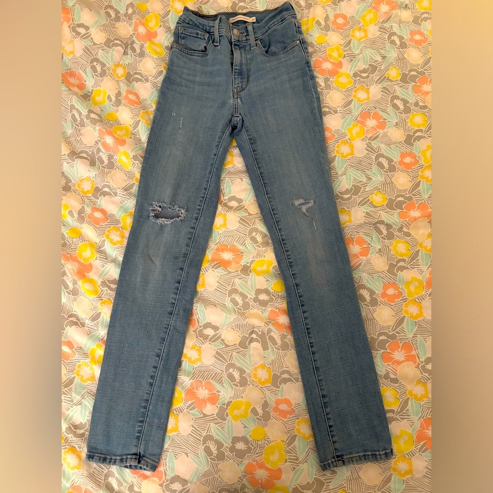 levi’s, size 24, light blue , holes are supposed to be there